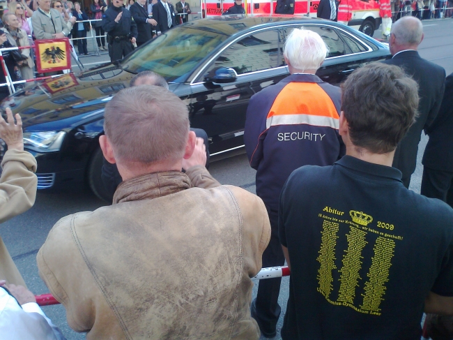 Daniela Schadt and Bundespräsident Joachim Gauck driving by, Sadly, the First Lady is more or less occluded on this shot of the limousine driving by