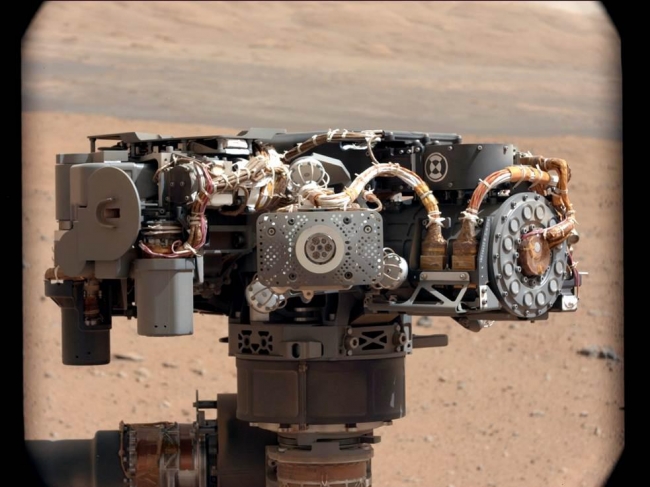 Portrait of APXS on Mars,  This image shows the Alpha Particle X-Ray Spectrometer (APXS) on NASA's Curiosity rover, with the Martian landscape in the background. The image was taken b...