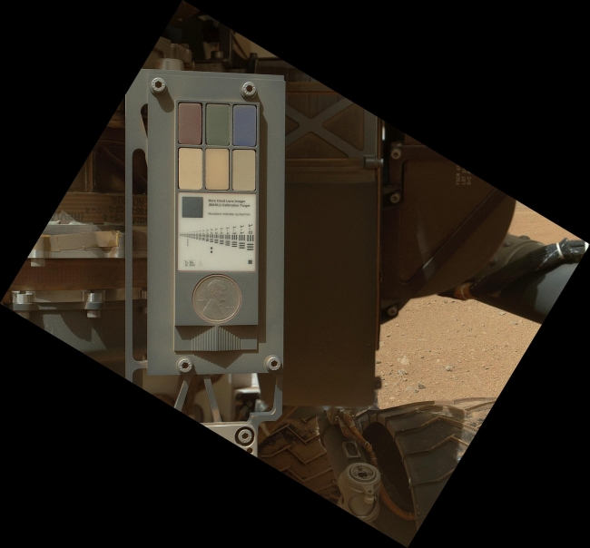 Calibration Target for Curiosity's Arm Camera,  This view of the calibration target for the Mars Hand Lens Imager (MAHLI) aboard NASA's Mars rover Curiosity combines two images taken by that camera during...