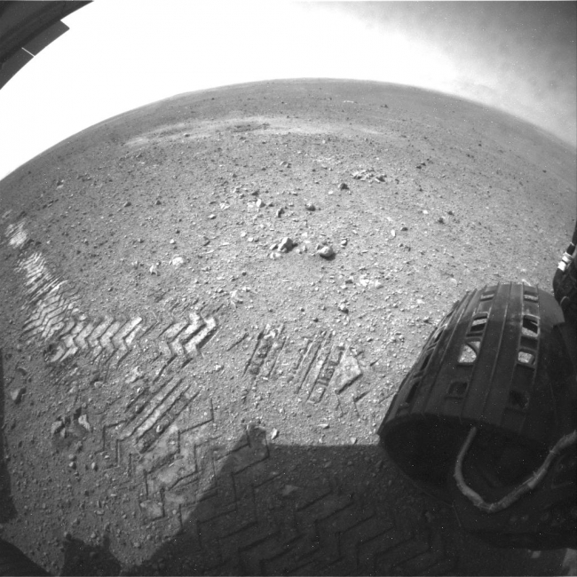 Curiosity Tracks Its Tracks, This image shows a close-up of track marks left by NASA's Curiosity rover. Holes in the rover's wheels, seen here in this view, leave imprints in the tracks ...