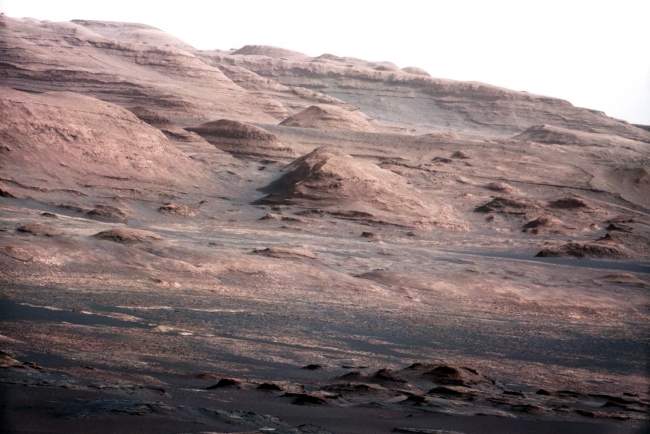 Layers at the Base of Mount Sharp,  Annotated Version Click on the image for larger version A chapter of the layered geological history of Mars is laid bare in this postcard from NASA's Curios...