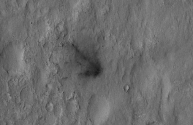 Signs of the Sky Crane's Impact,  This close-up view shows darkened radial jets caused by the impact of Curiosity's sky crane, which helped deliver the rover to the surface of Mars. The imag...