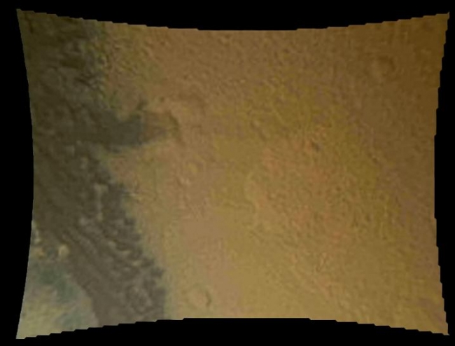 Martian Surface Below Curiosity,  This color thumbnail image was obtained by NASA's Curiosity rover during its descent to the surface of Mars on Aug. 5 PDT (Aug. 6 EDT). This image from Curi...