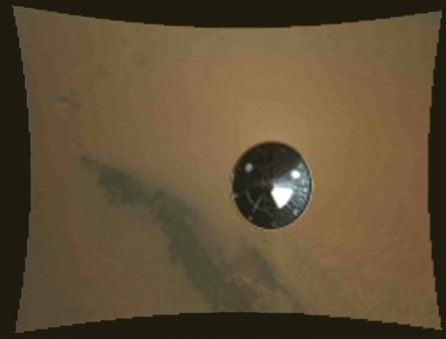 Curiosity's Heat Shield in View,  This color thumbnail image was obtained by NASA's Curiosity rover during its descent to the surface of Mars on Aug. 5 PDT (Aug. 6 EDT). The image was obtain...