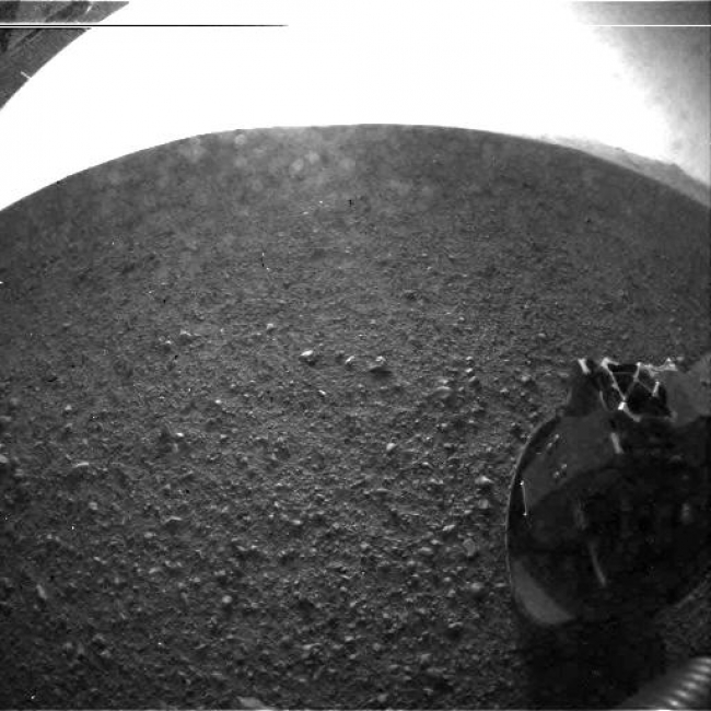 Curiosity's Surroundings,  This is one of the first images taken by NASA's Curiosity rover, which landed on Mars the evening of Aug. 5 PDT (morning of Aug. 6 EDT). It was taken throug...