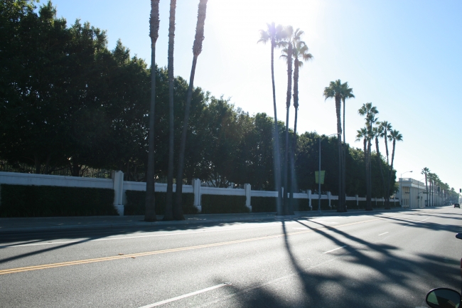 Looking down Washington Blvd. with the Western fensce of the Sony Pictures Lot, with "The Collonnade" on the far right, the Thalberg Lot is behind the green