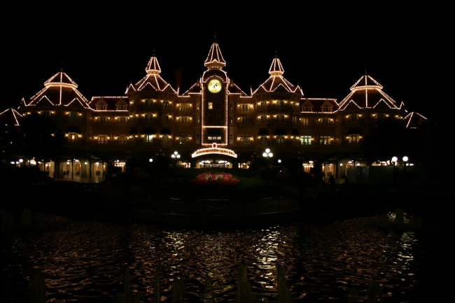 Disneyland Paris main entry and Disneyland Hotel, at night